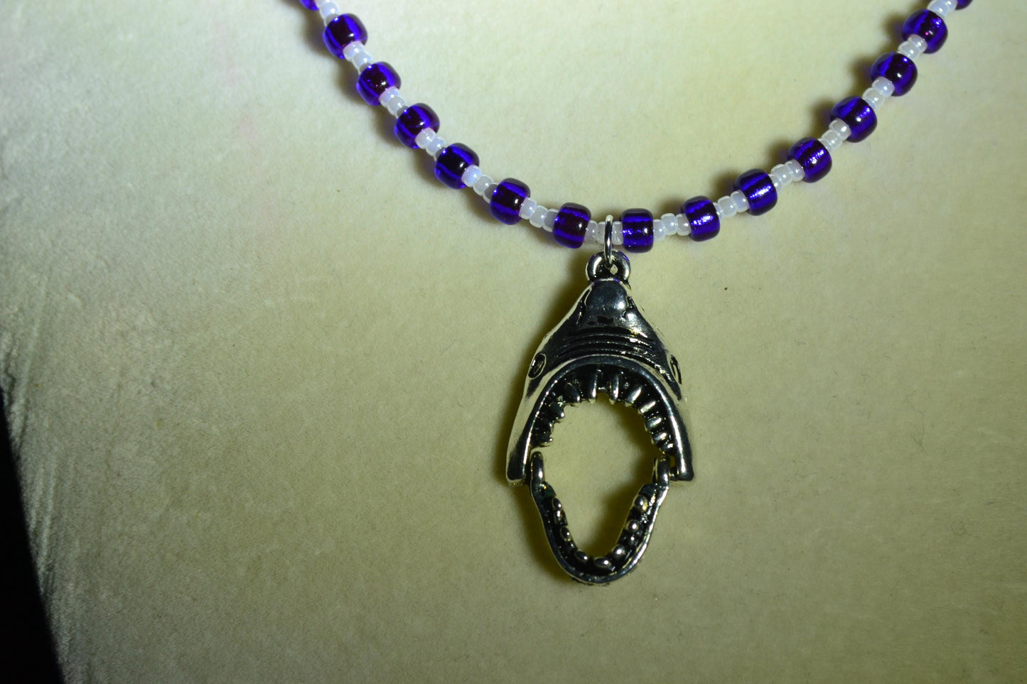 Shark Jaws pendant glass bead necklace. Blue and pearl