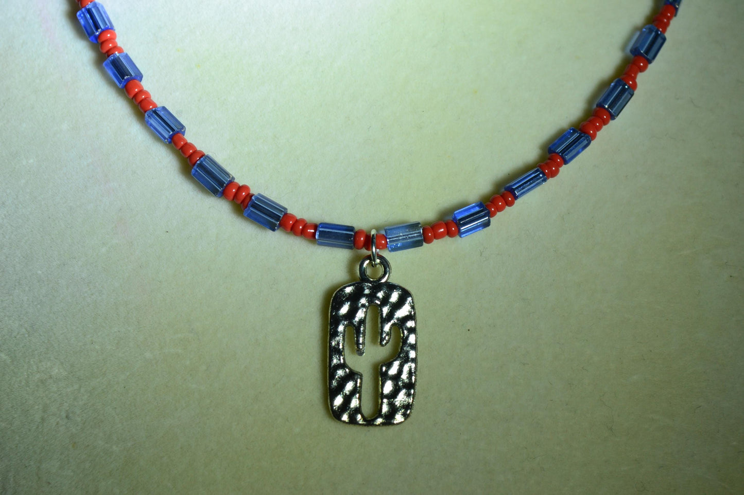 Cactus pendant glass bead necklace. Blue and red