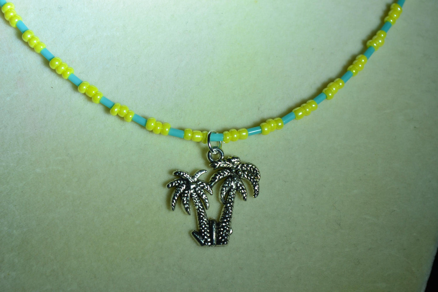 Palm Trees pendant glass bead necklace. Aqua and yellow