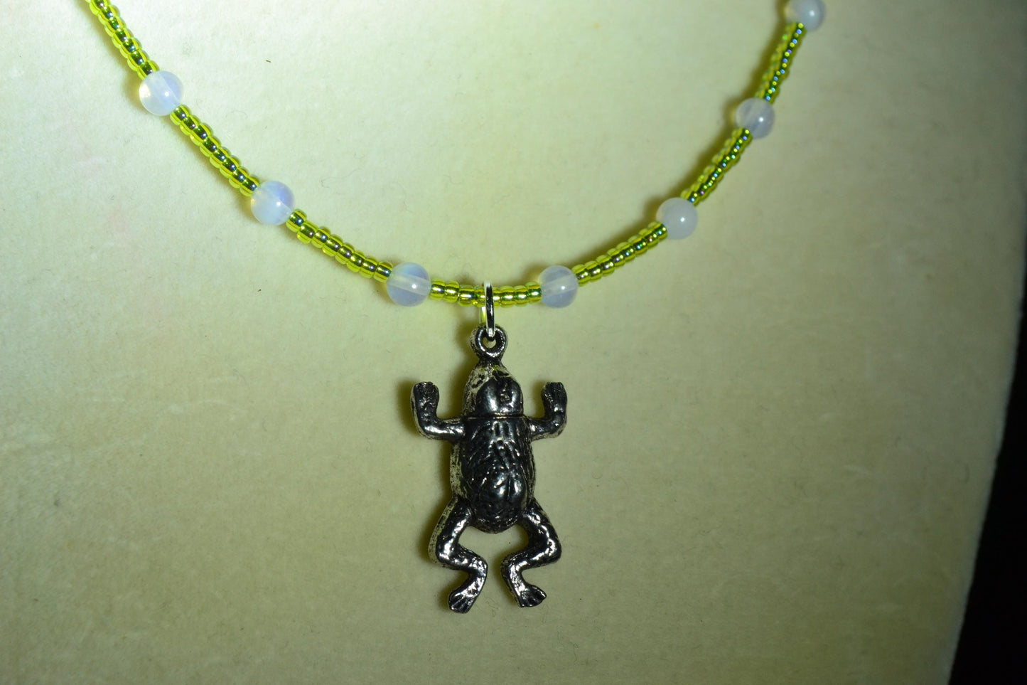 Frog pendant glass bead necklace. Green and moonstone