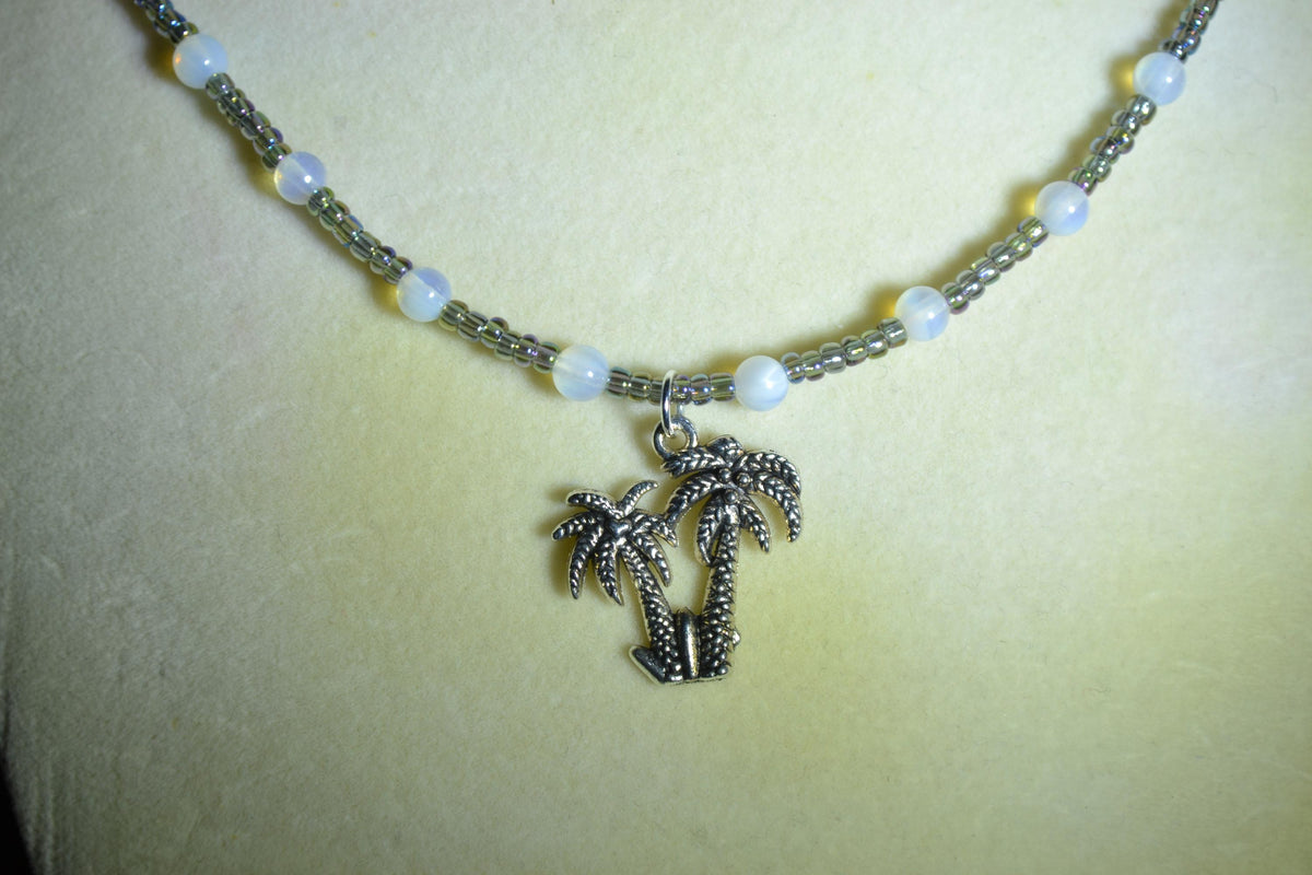 Palm tree pendant glass bead necklace. Oil spill and moonstone