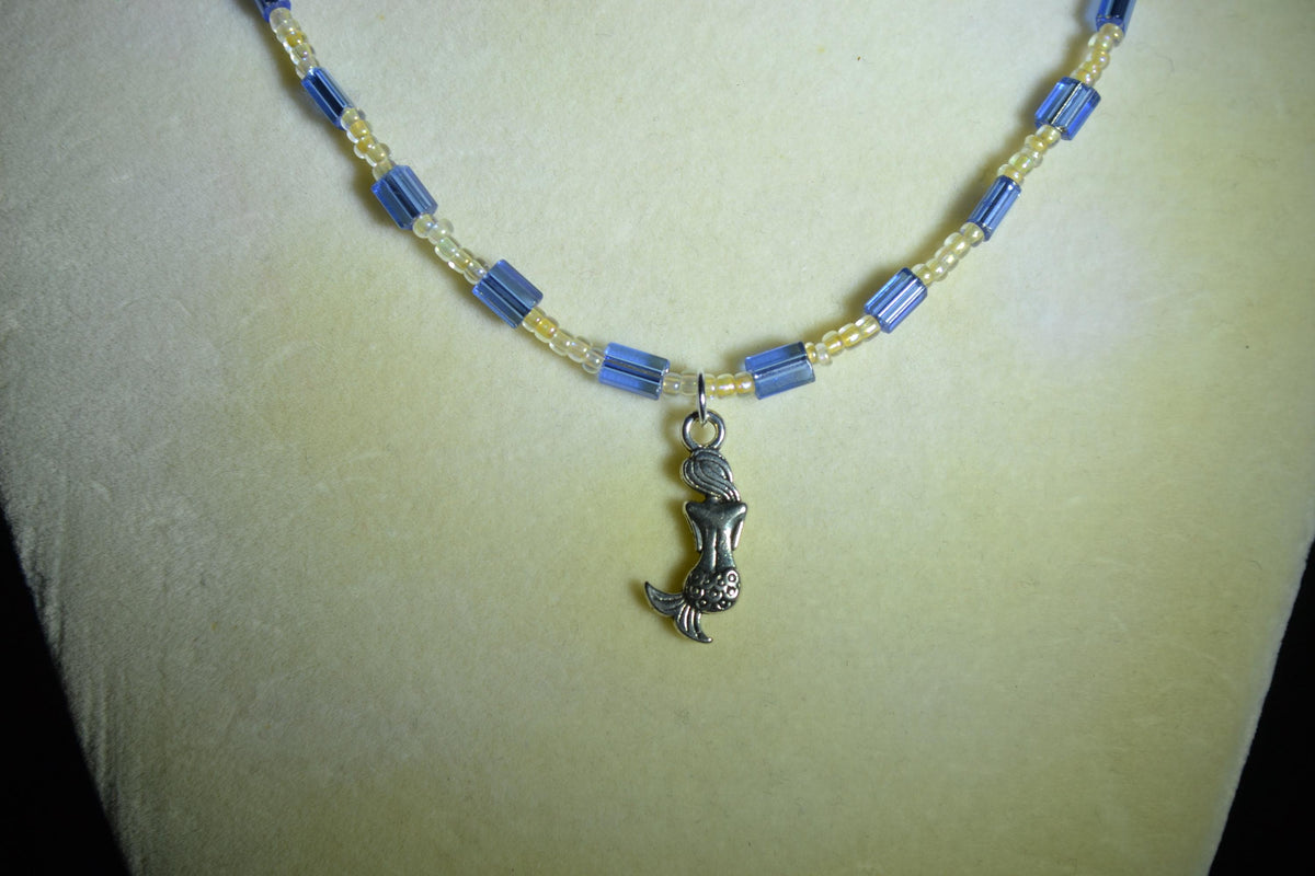 Silver Mermaid pendant glass bead necklace. Blue and sand