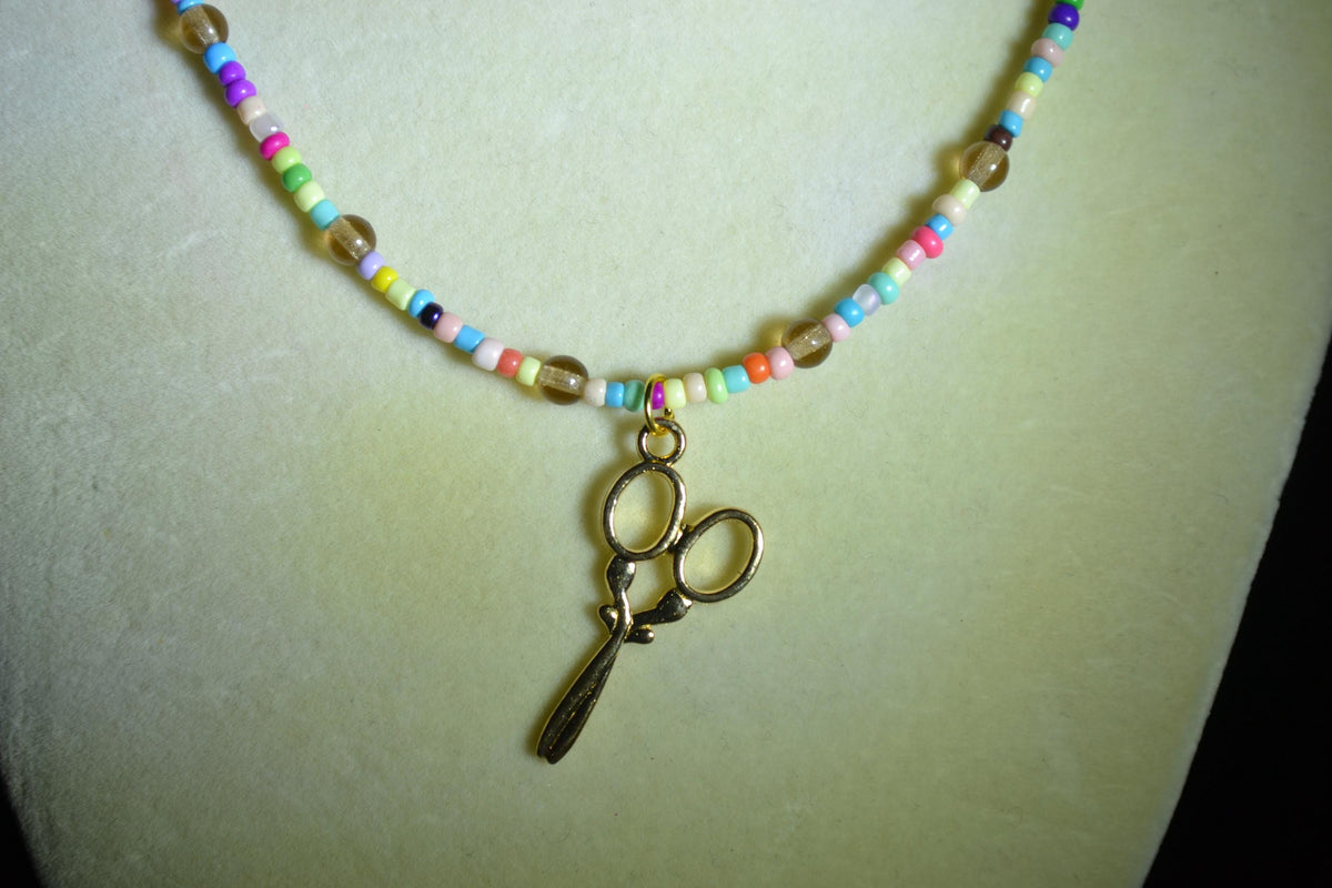 Gold Scissor pendant glass bead necklace. Rainbow and natural