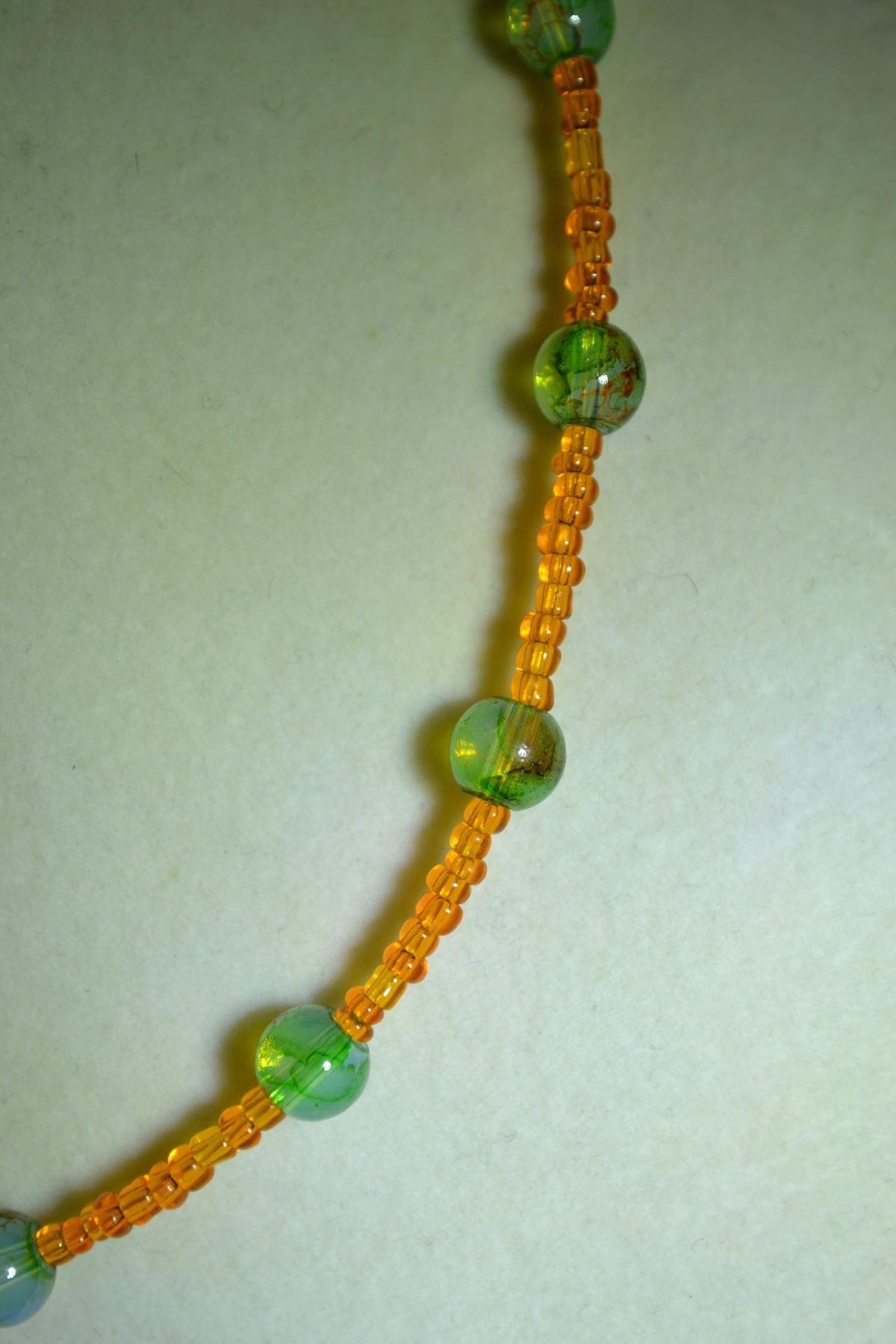Multicolor glass bead necklace. Orange and crackled green