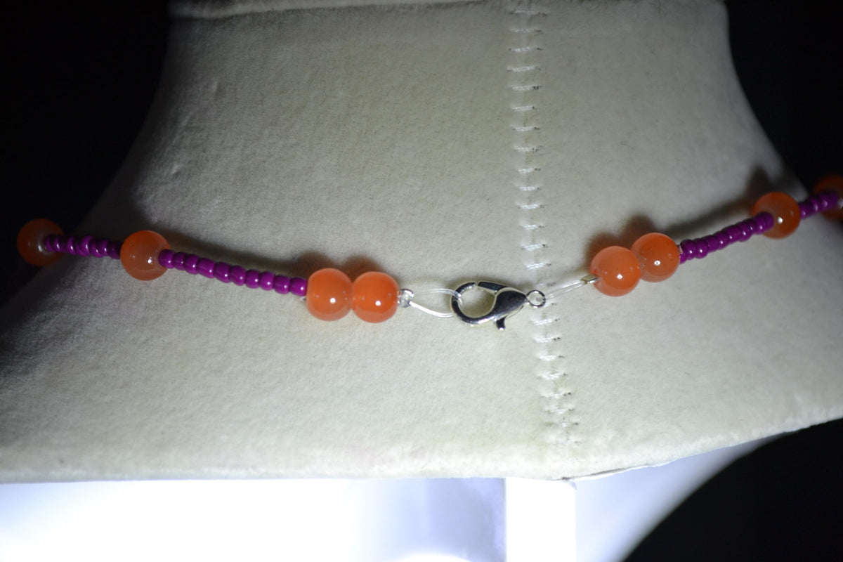 Multicolor glass bead necklace. Orange and berry