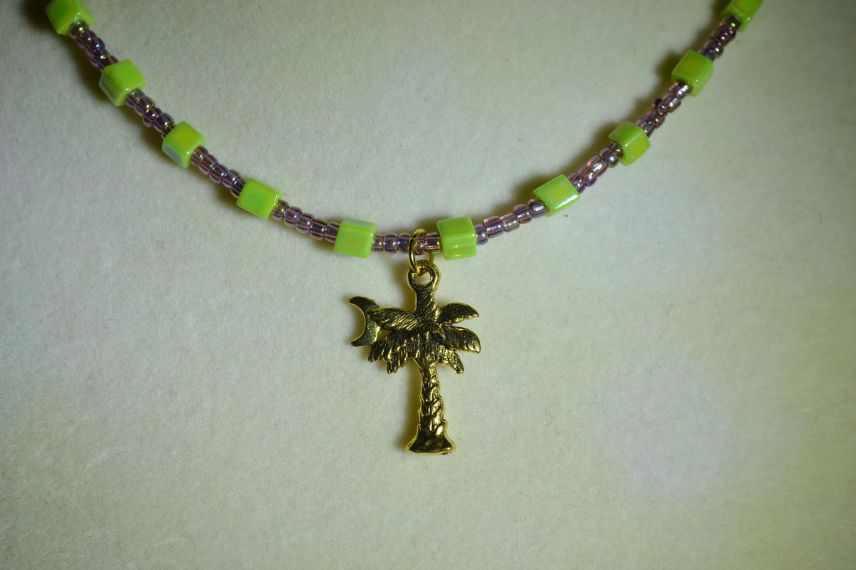 Gold Palm tree pendant glass bead necklace. Amethyst and lime