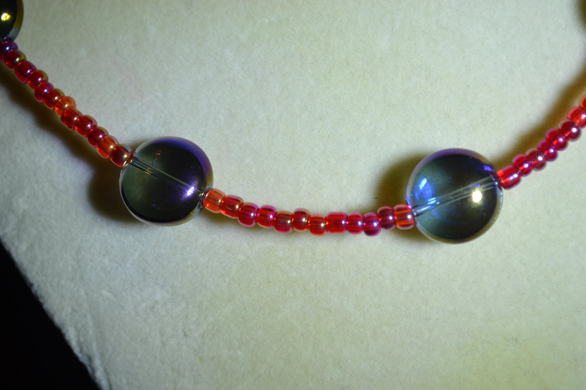 Multicolor glass bead necklace. Iridescent blue and raspberry