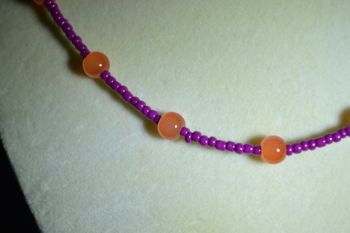 Multicolor glass bead necklace. Orange and berry