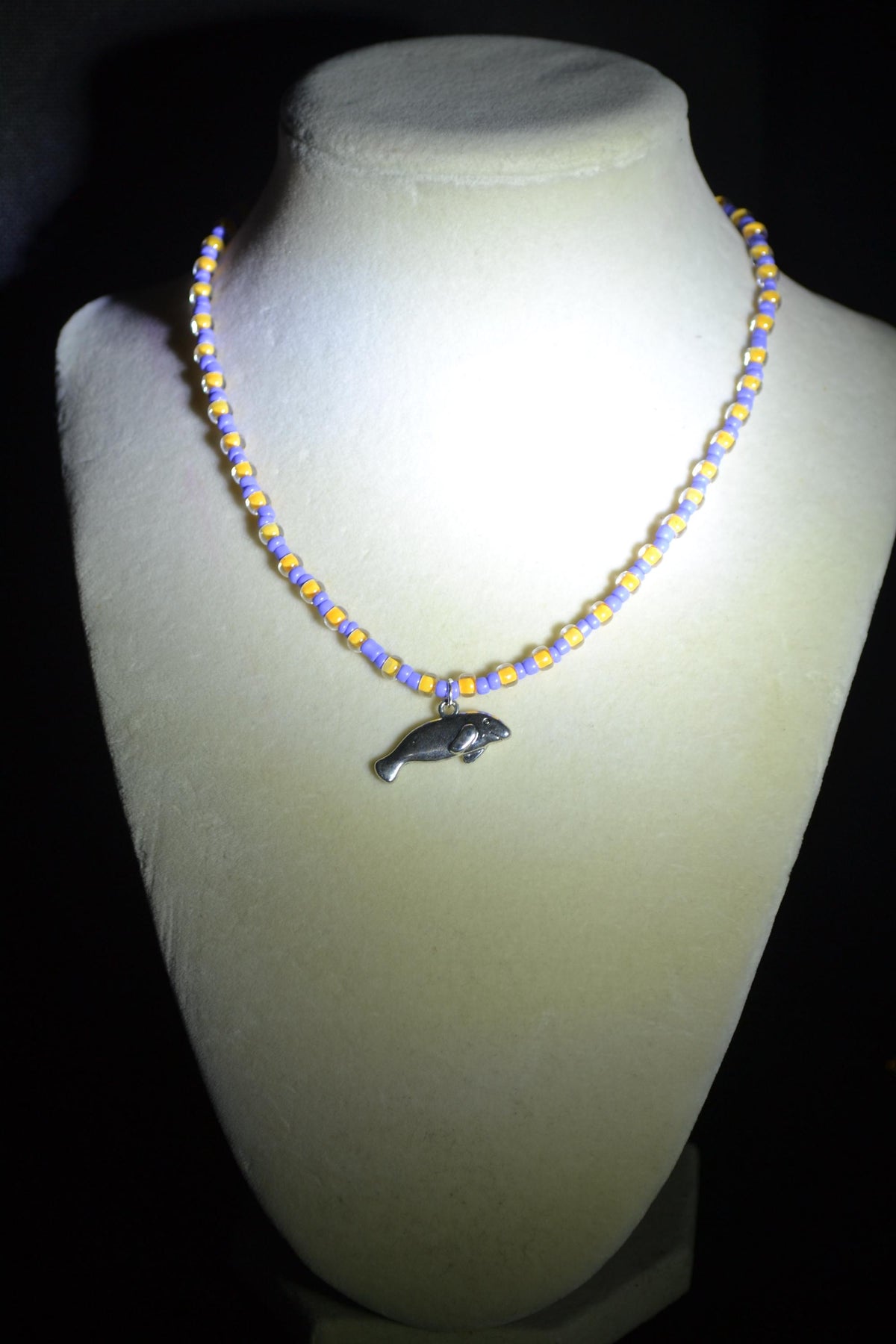Manatee pendant glass bead necklace. Periwinkle and yellow