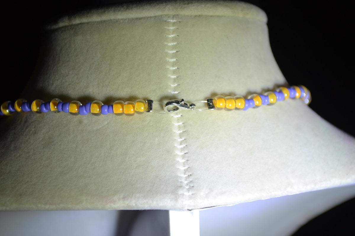 Manatee pendant glass bead necklace. Periwinkle and yellow