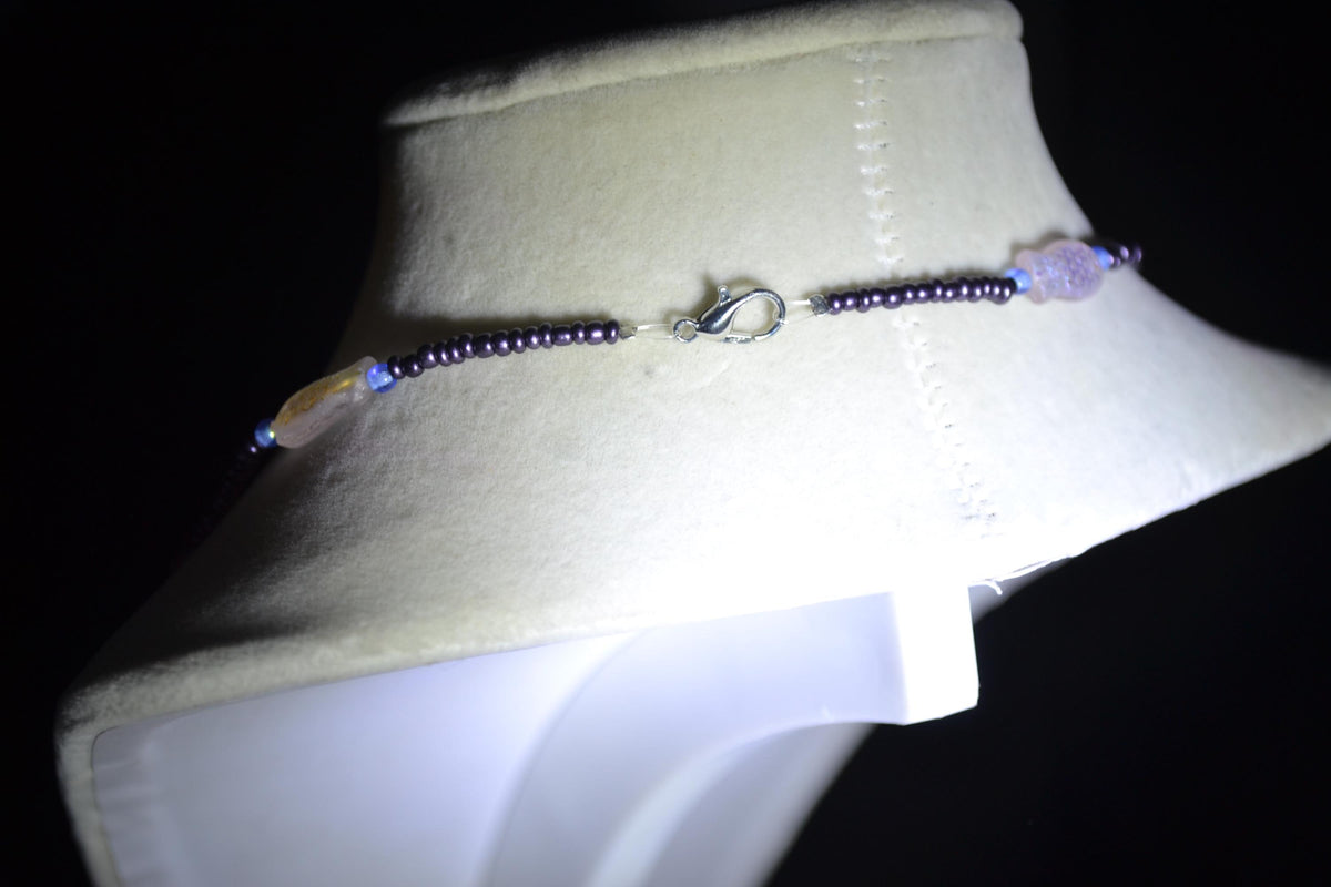 Beaded fish necklace. Blue, metallic purple, and iridescent
