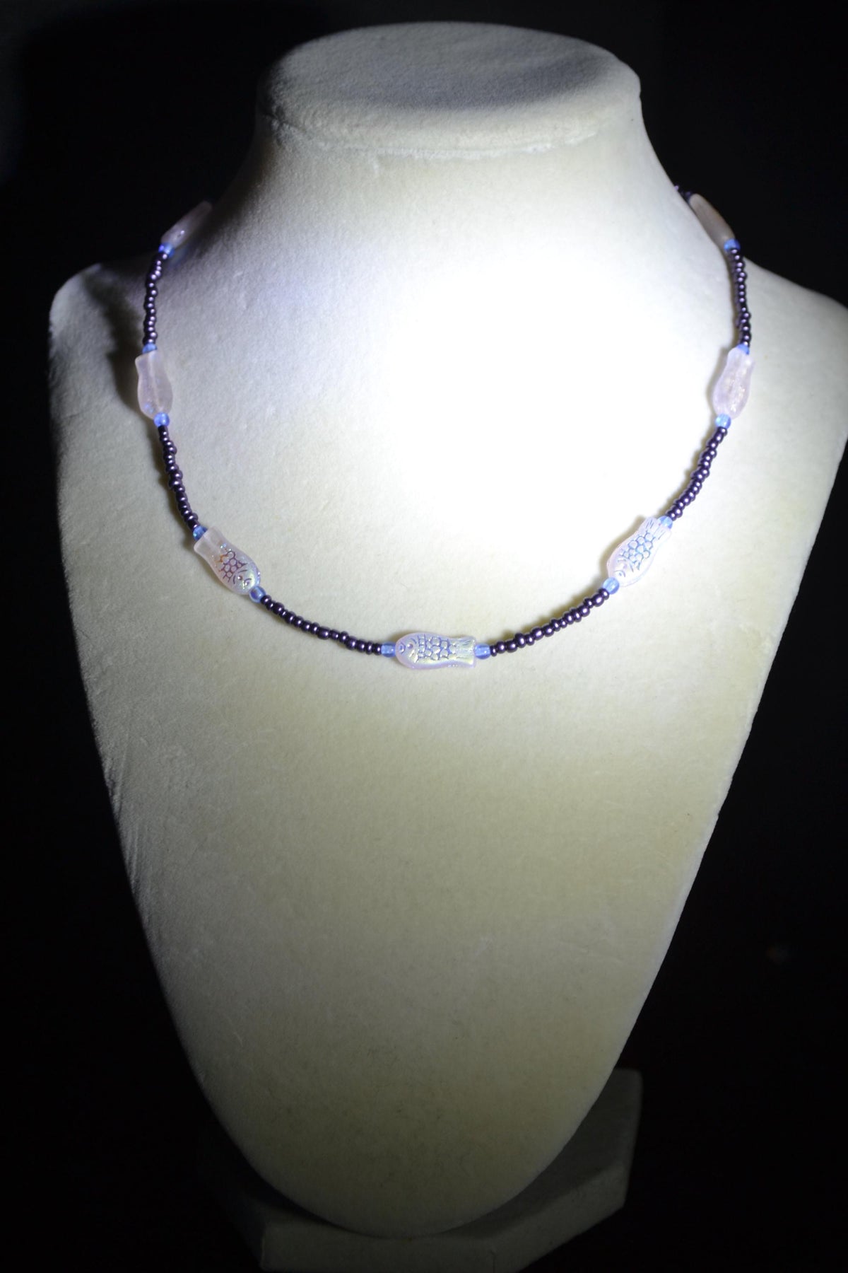 Beaded fish necklace. Blue, metallic purple, and iridescent