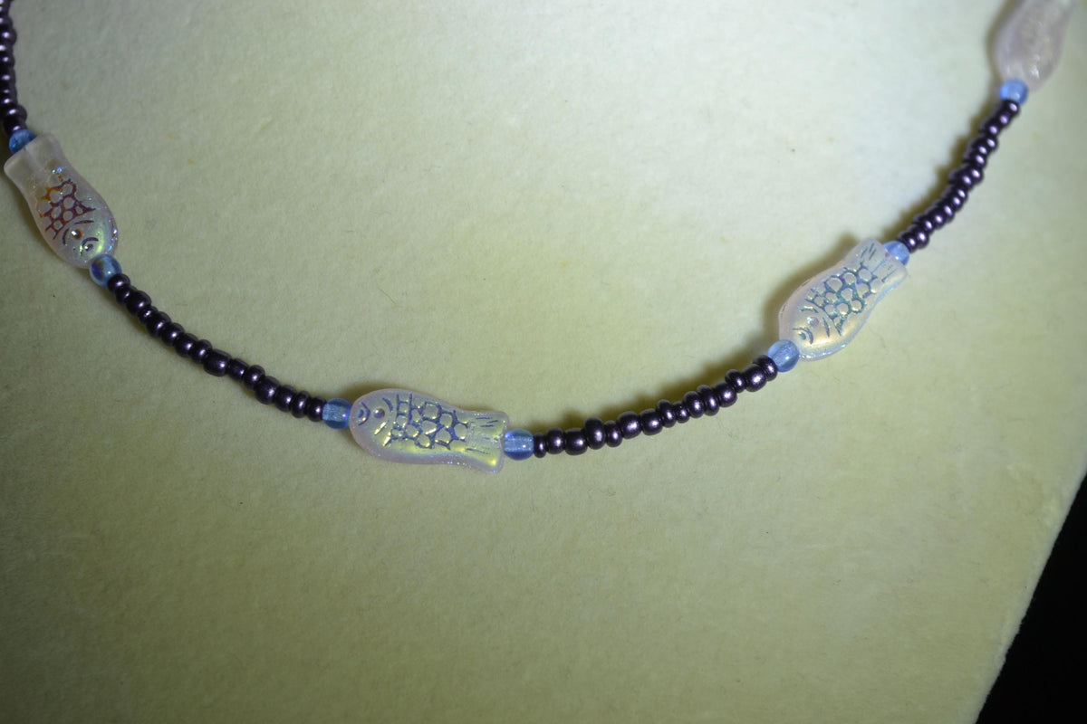 Beaded fish necklace. Blue, metallic purple, and iridescent