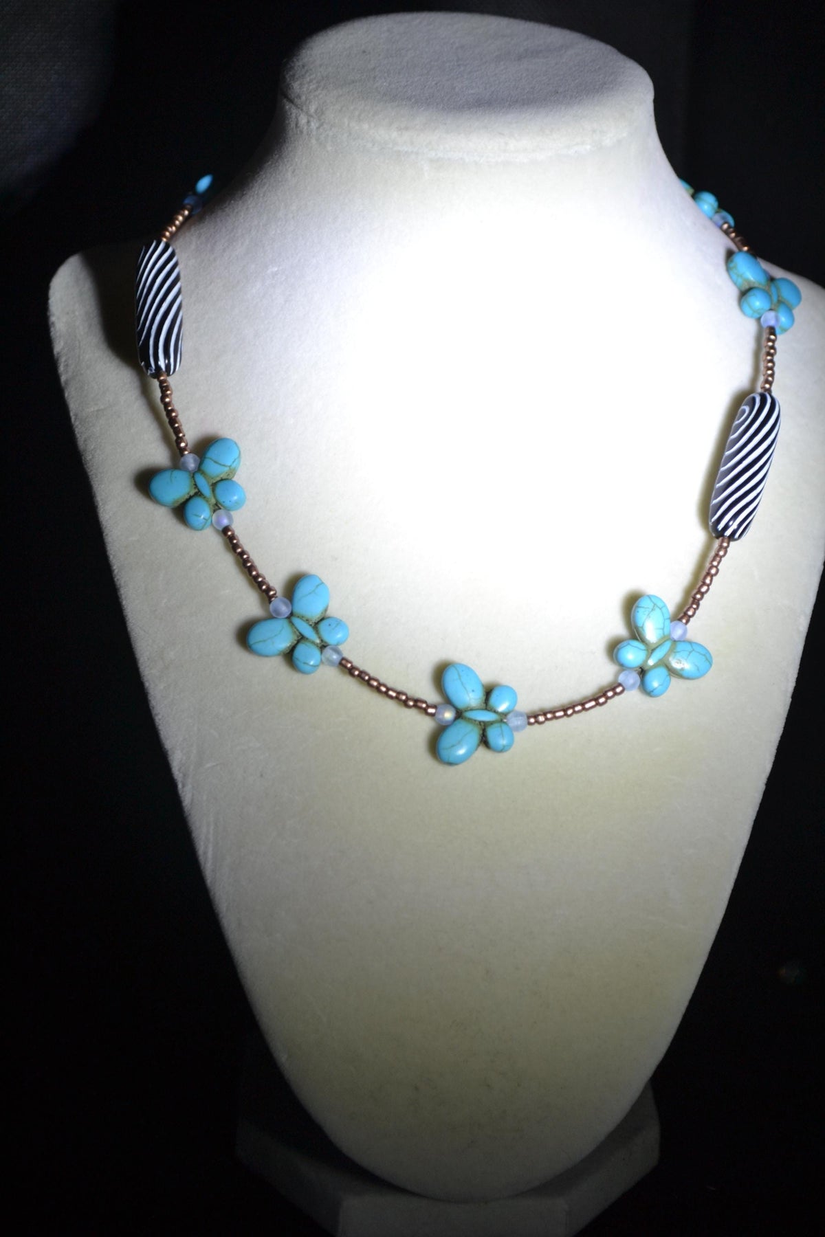 Beaded Butterfly glass necklace. Turquoise, copper, and striped