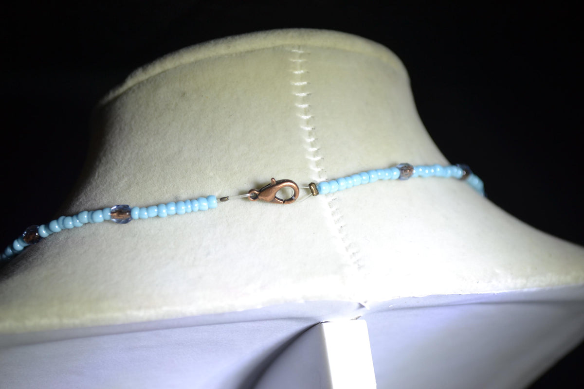 Wire wrapped sharks tooth beaded necklace. Silver and blue