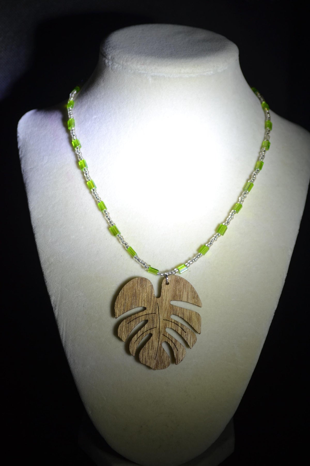 Wooden Monstera pendant glass bead necklace. Green and silver