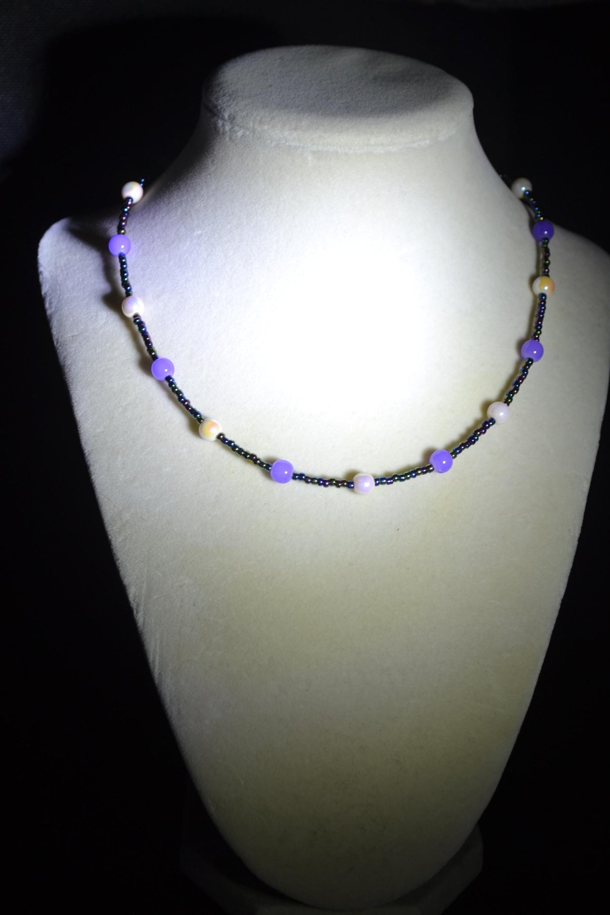 Multicolor glass bead necklace. Pearlescent white, purple. and oil spill