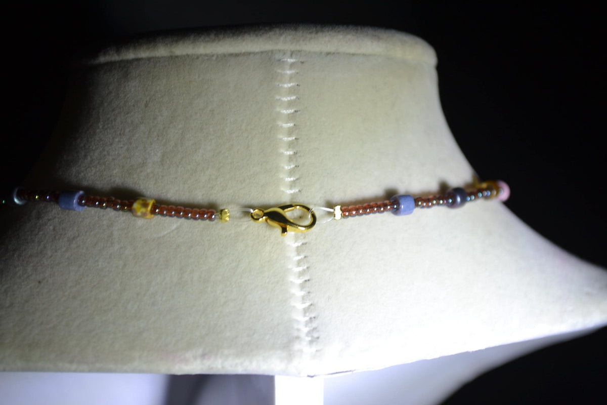 Gold Angelfish pendant glass bead choker. Iridescent brown & mixed Picasso