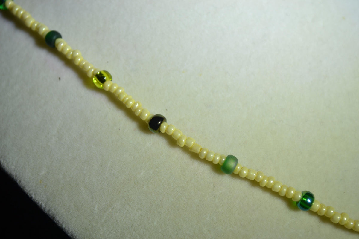 Wooden Monstera pendant glass bead necklace. Yellow & mixed greens