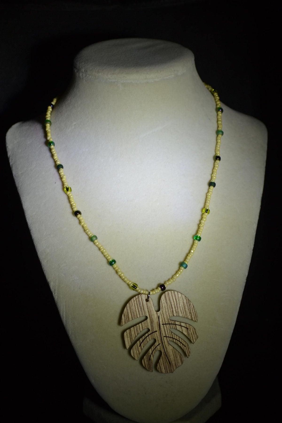 Wooden Monstera pendant glass bead necklace. Yellow & mixed greens