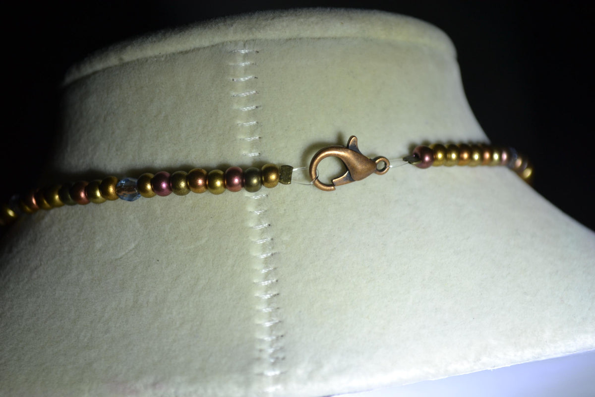 Bronze Dragonfly pendant glass bead necklace. Mixed bronzes and light blue