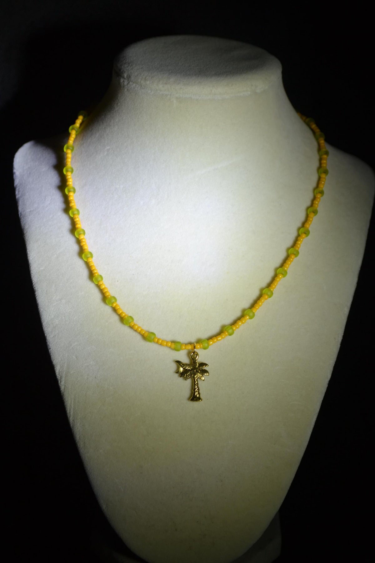 Gold palm pendant glass bead necklace. Tangerine & frosted green