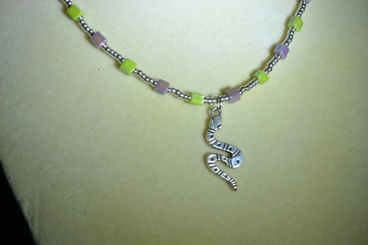 Silver snake pendant glass bead necklace. Iridescent purple & green and silver