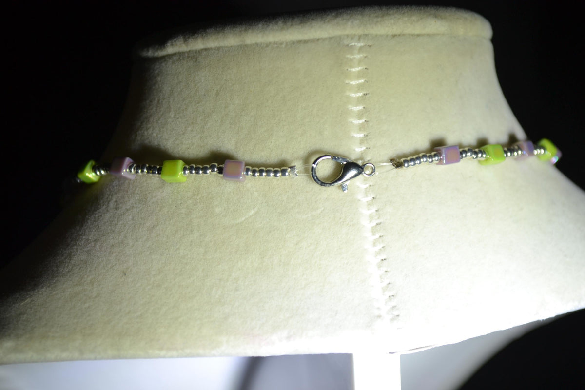 Silver snake pendant glass bead necklace. Iridescent purple & green and silver