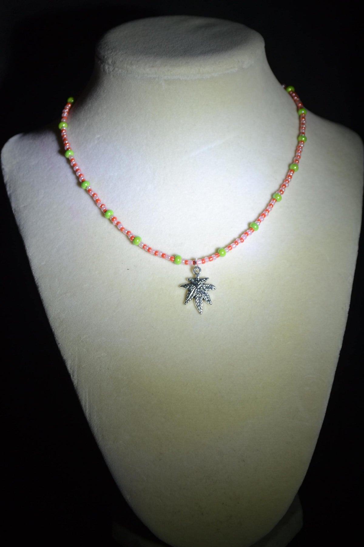 Silver marijuana pendant glass bead choker. Green, white, and orange
