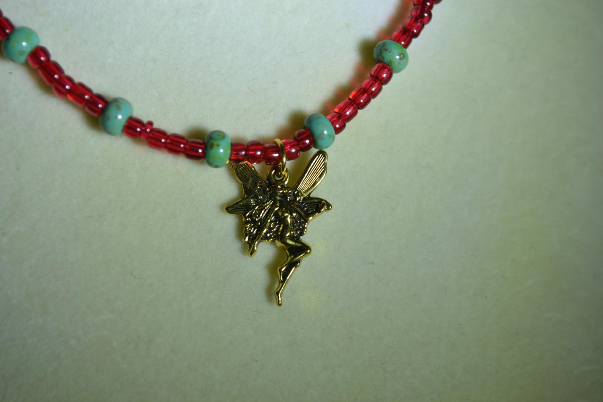 Gold fairy pendant glass bead choker. Red & Picasso turquoise