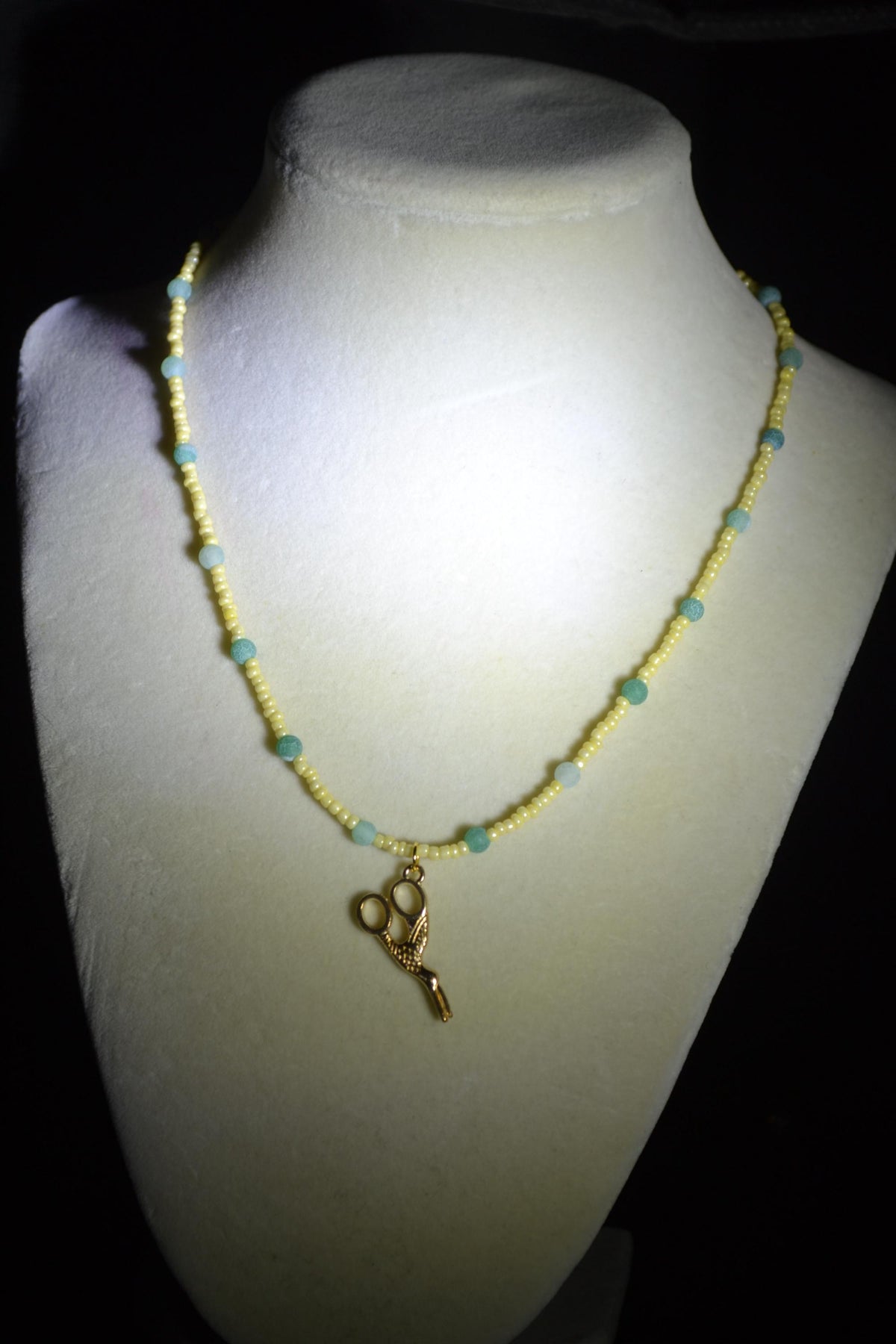 Gold scissor pendant glass bead necklace. Yellow and jade
