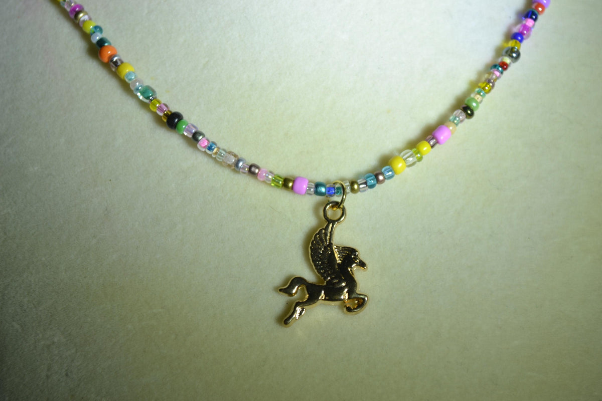 Gold Pegasus pendant glass bead choker. Rainbow