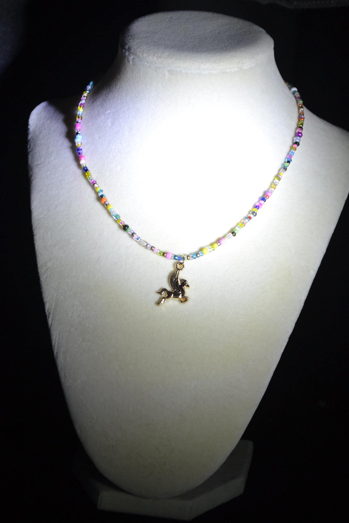 Gold Pegasus pendant glass bead choker. Rainbow