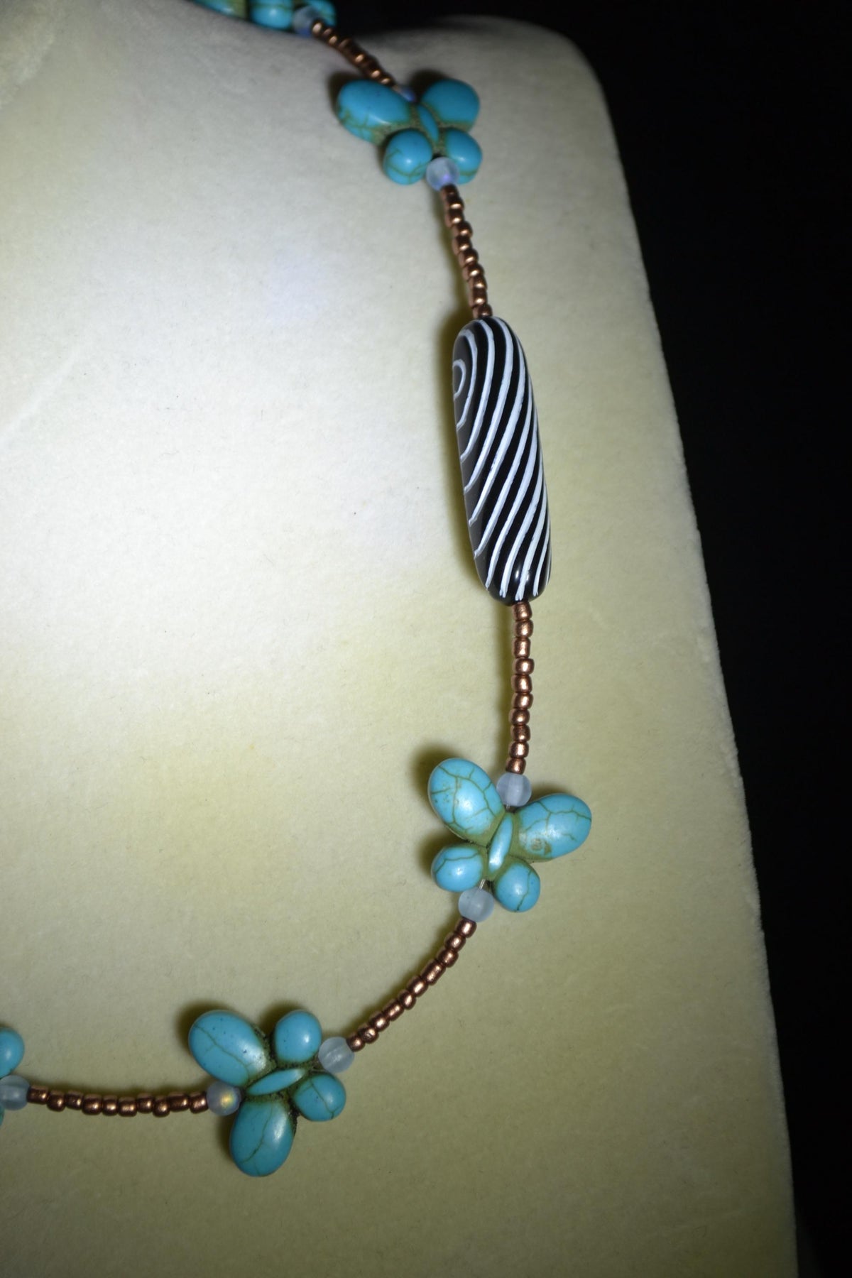 Beaded Butterfly glass necklace. Turquoise, copper, and striped