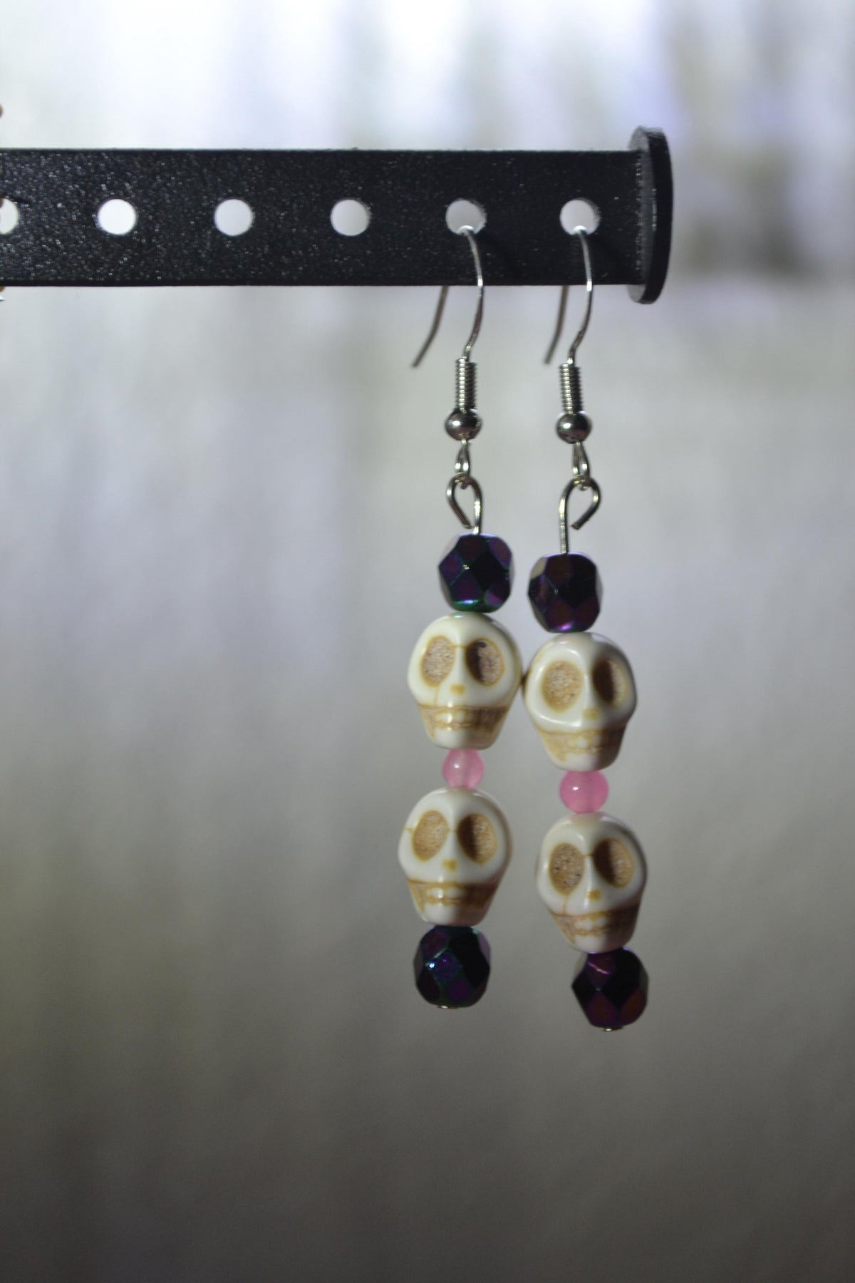 Beaded Skull Earrings. Metallic purple and pink