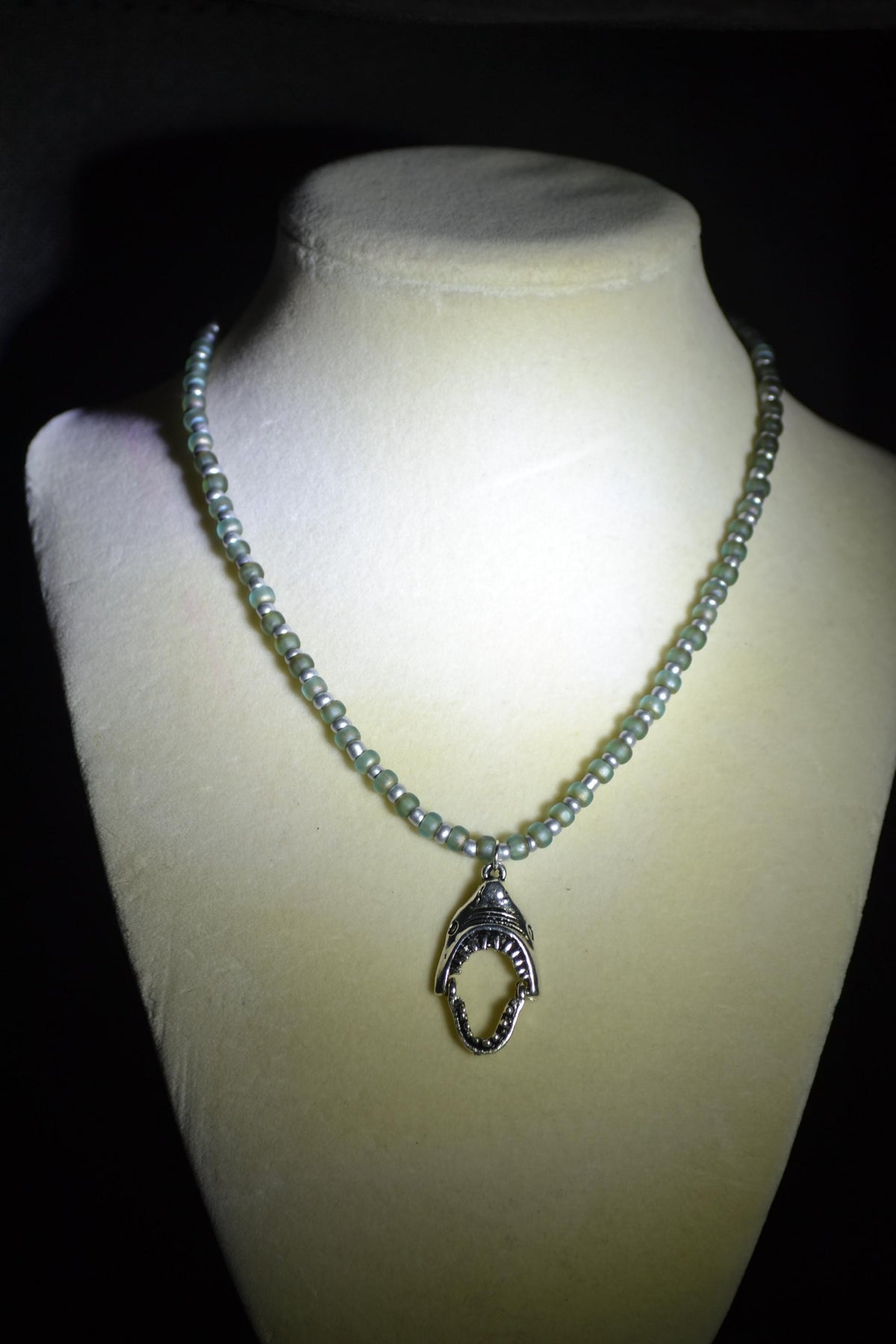Silver Shark jaws pendant glass bead necklace. Frosted blue & silver