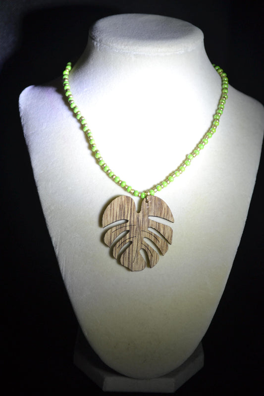 Wooden Monstera pendant glass bead necklace. Green and gold