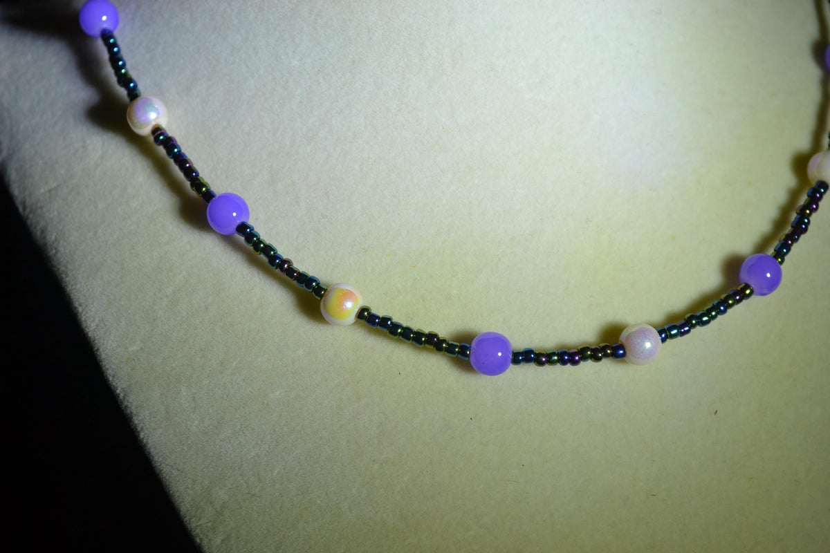 Multicolor glass bead necklace. Pearlescent white, purple. and oil spill