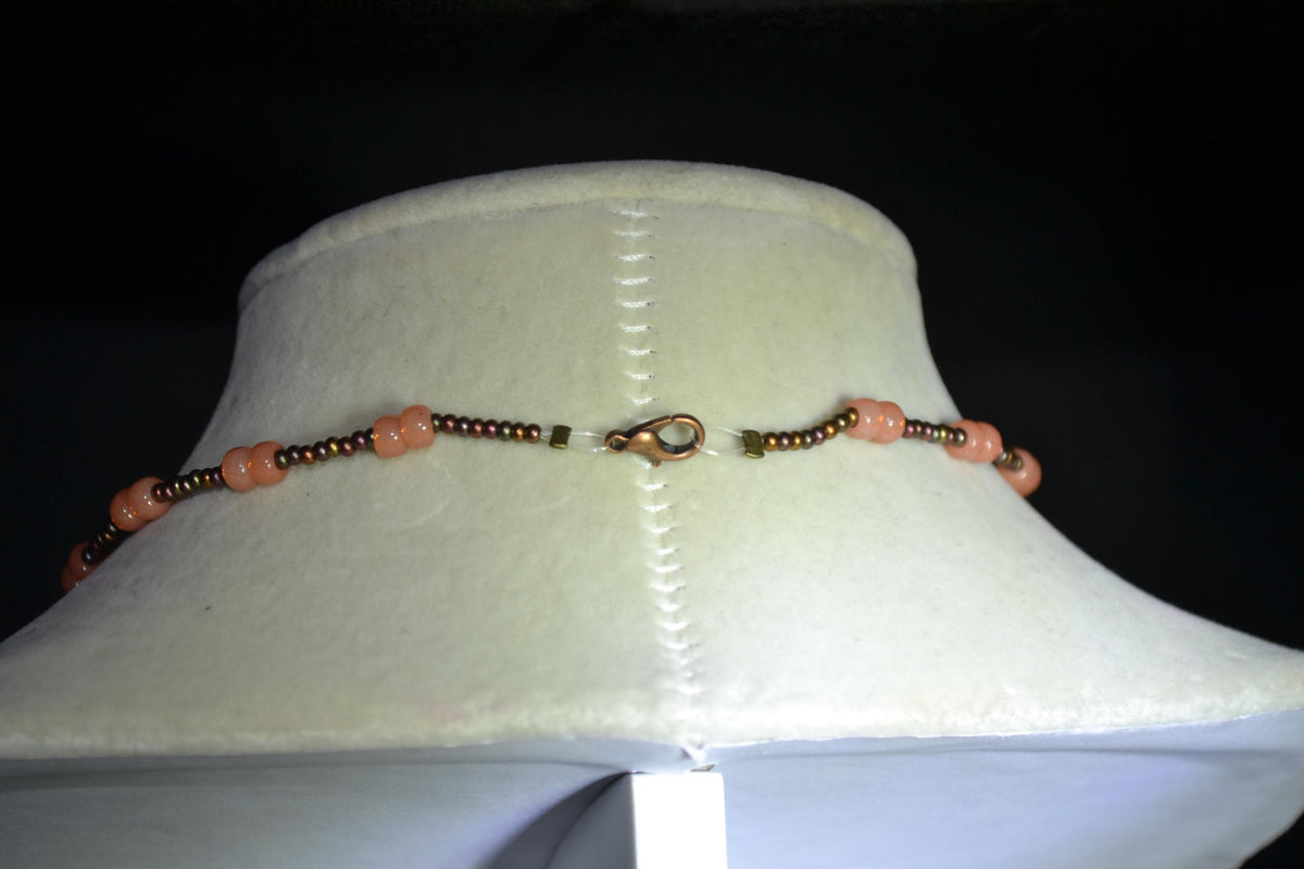 Bronze butterfly pendant glass bead necklace. Bronzes and coral