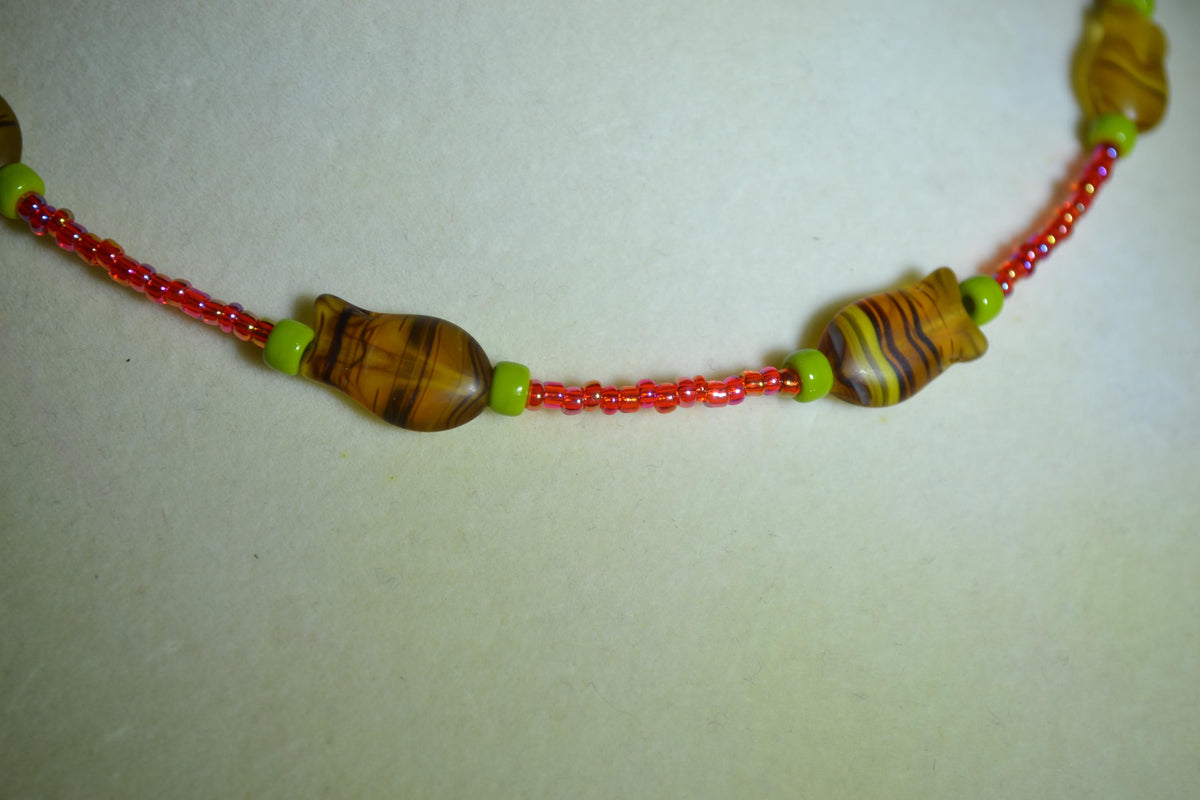 Beaded fish choker. Raspberry, olive, and topaz