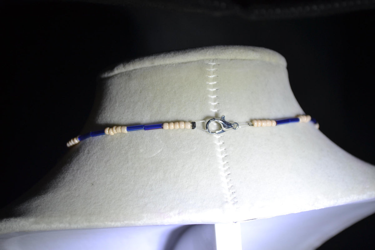 Silver turtle pendant glass bead necklace. Iridescent blue & sand