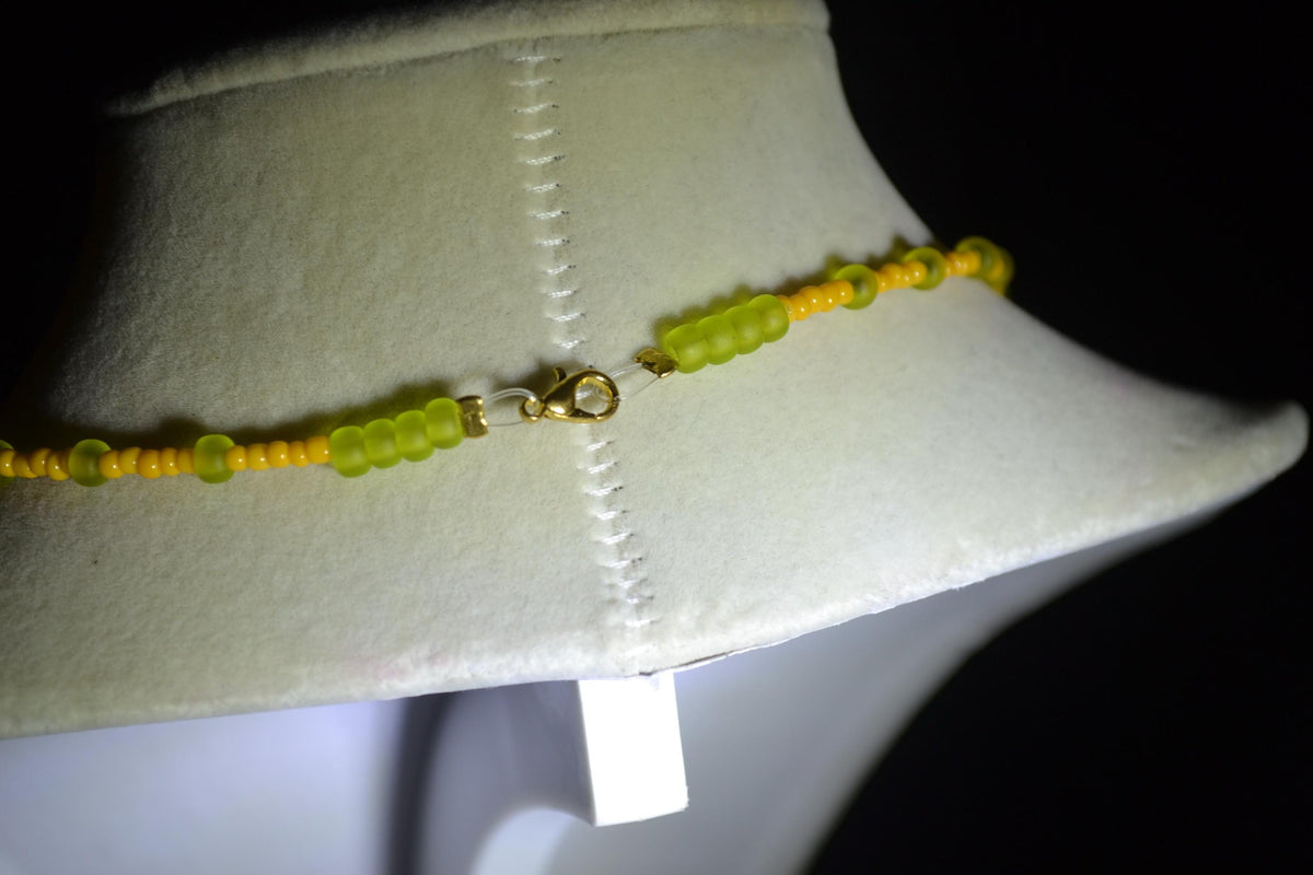 Gold palm pendant glass bead necklace. Tangerine & frosted green