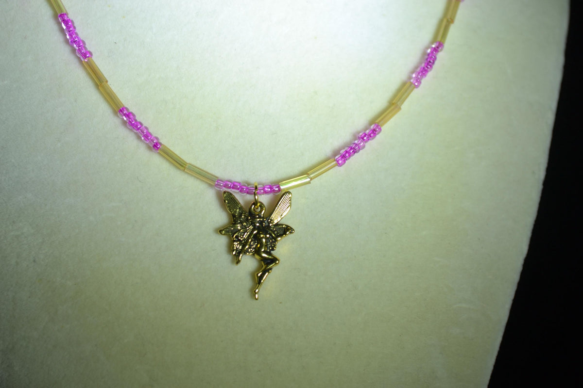 Gold fairy pendant glass bead necklace. Iridescent yellow & fuchsia