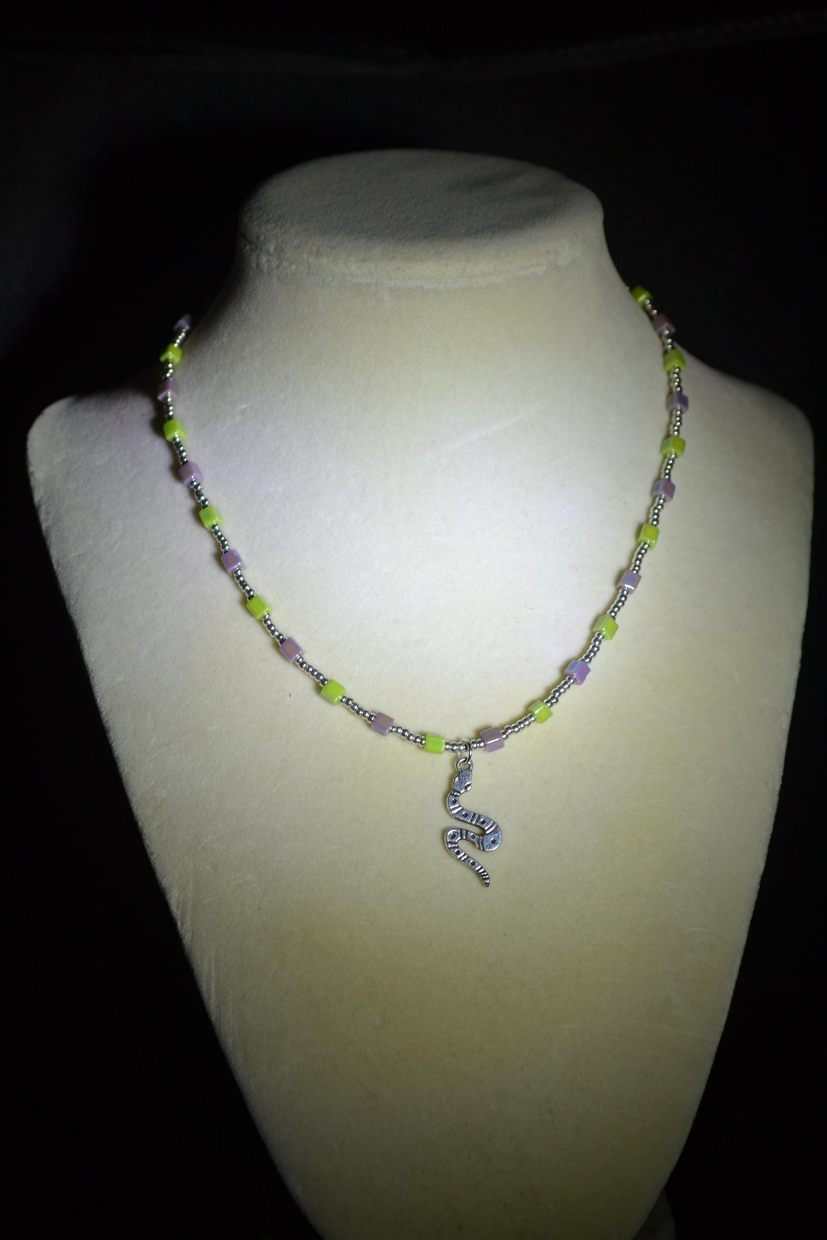 Silver snake pendant glass bead necklace. Iridescent purple & green and silver