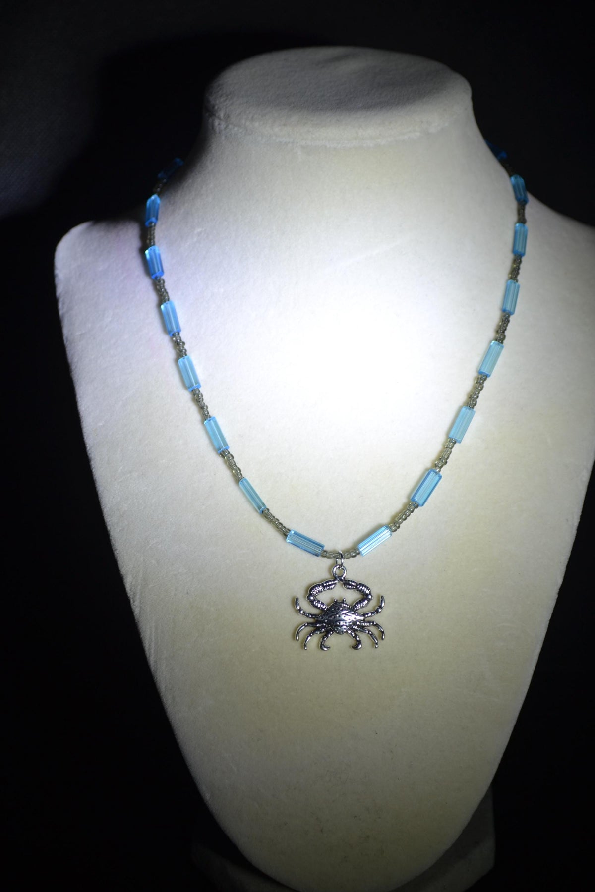 Silver crab pendant glass bead necklace. Blue and gray