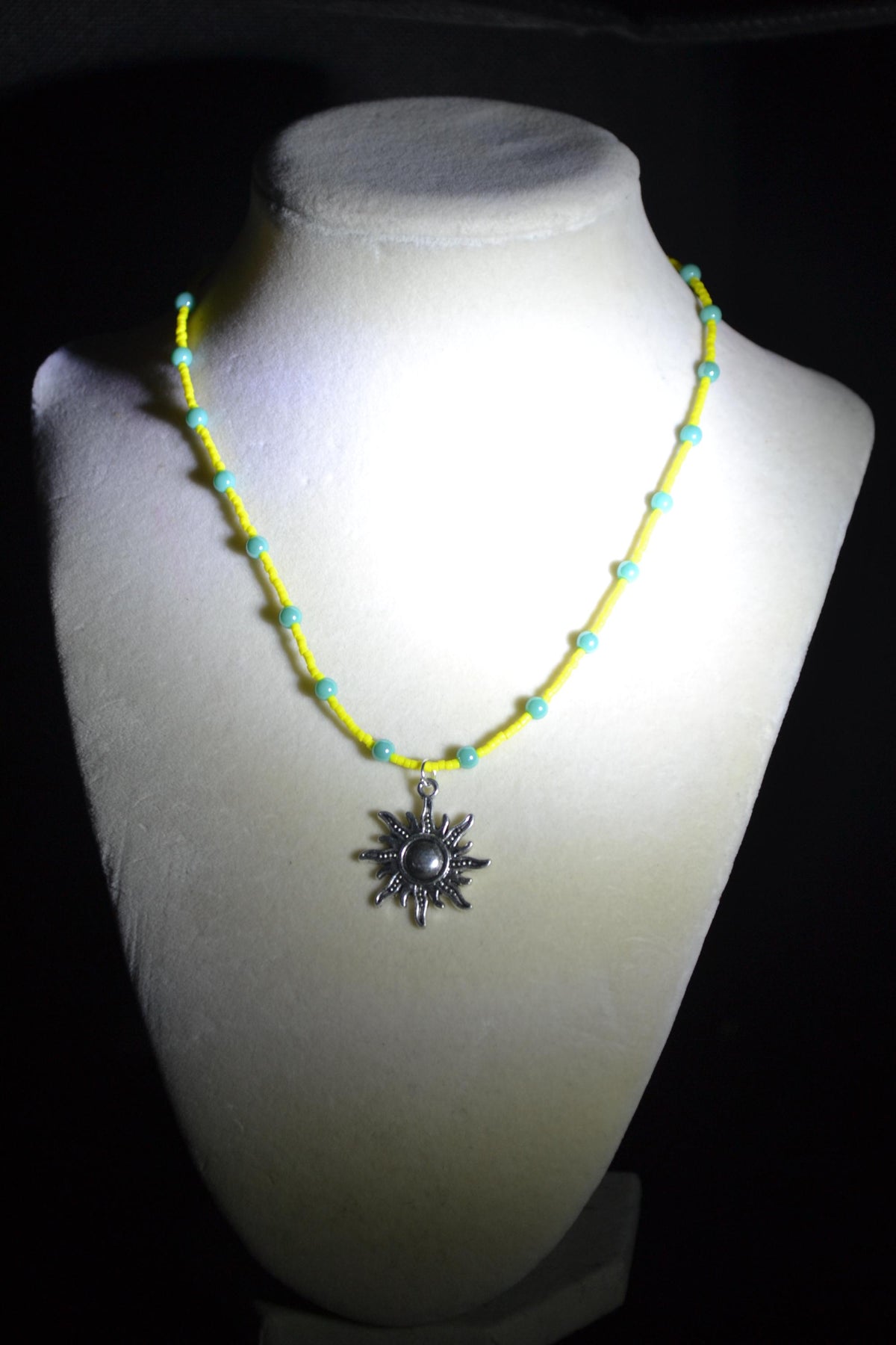 Silver sun pendant glass bead necklace. Yellow and turquoise