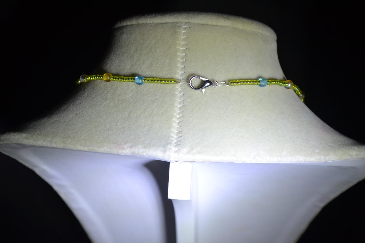 Silver mushroom pendant glass bead necklace. Green, blue, purple, and orange