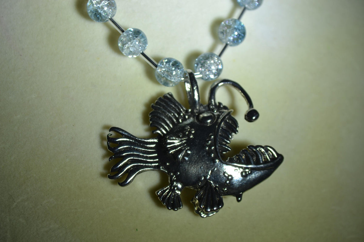 Silver anglerfish pendant glass bead choker. Crackled blue and silver