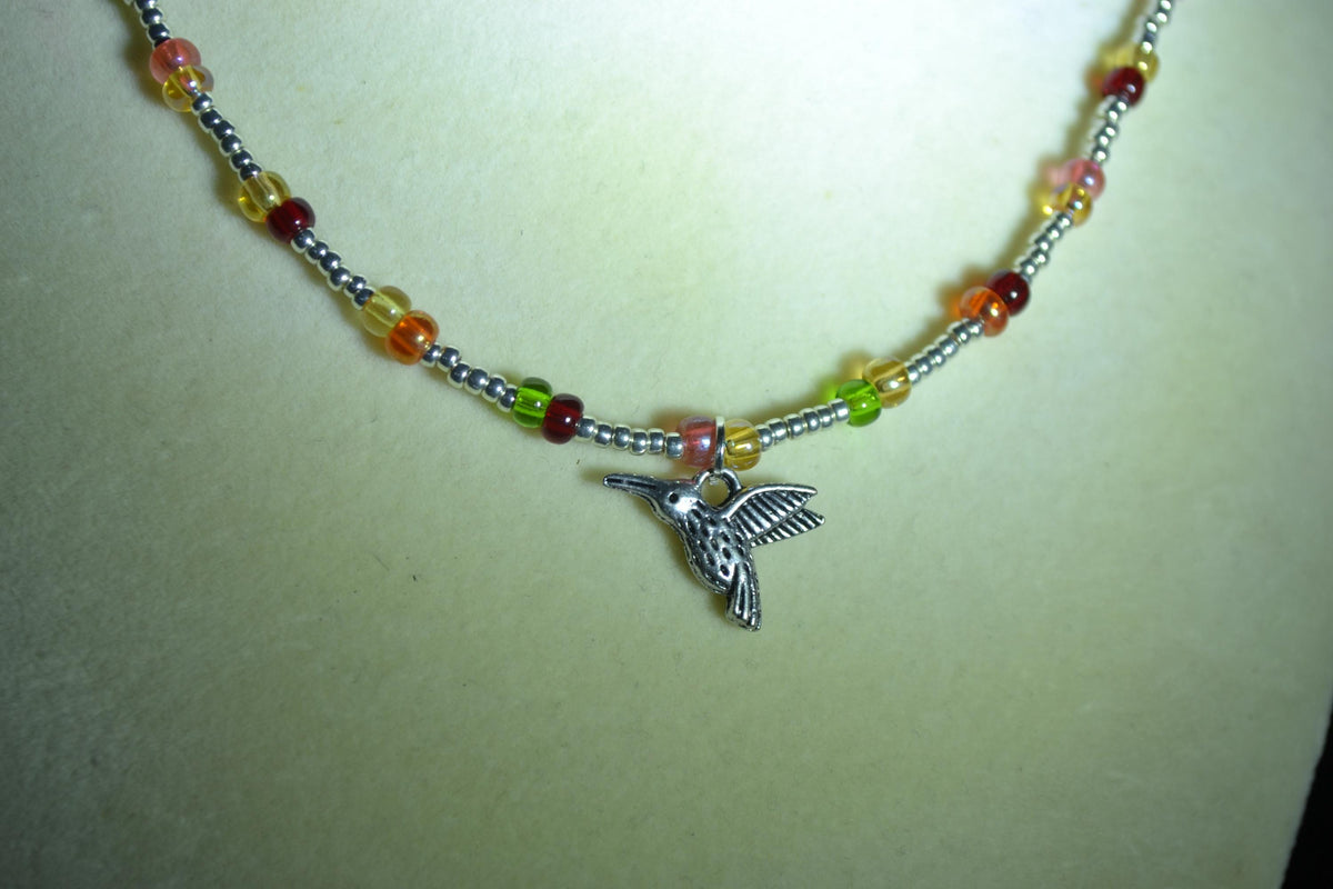 Silver Hummingbird pendant glass bead choker. Silver and skittles