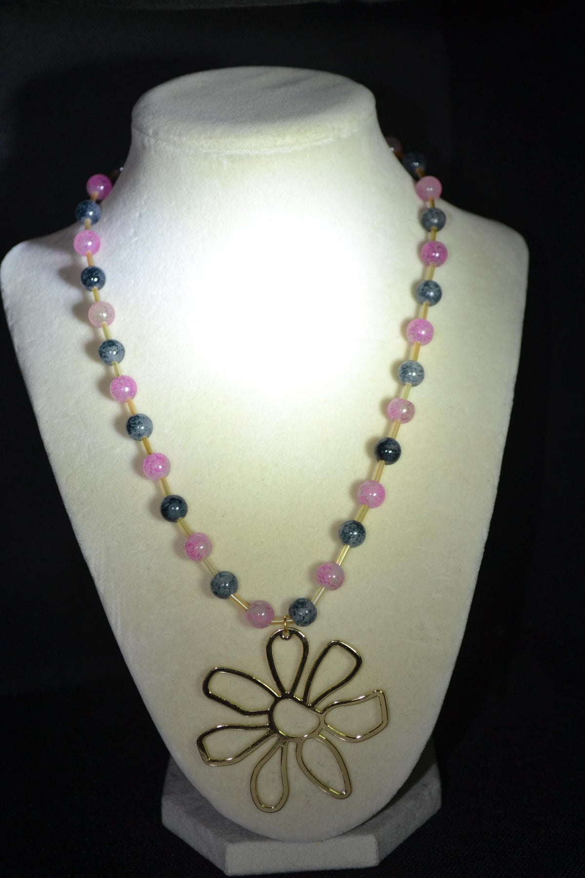 Gold Flower pendant glass bead necklace. Pink, black, and champagne